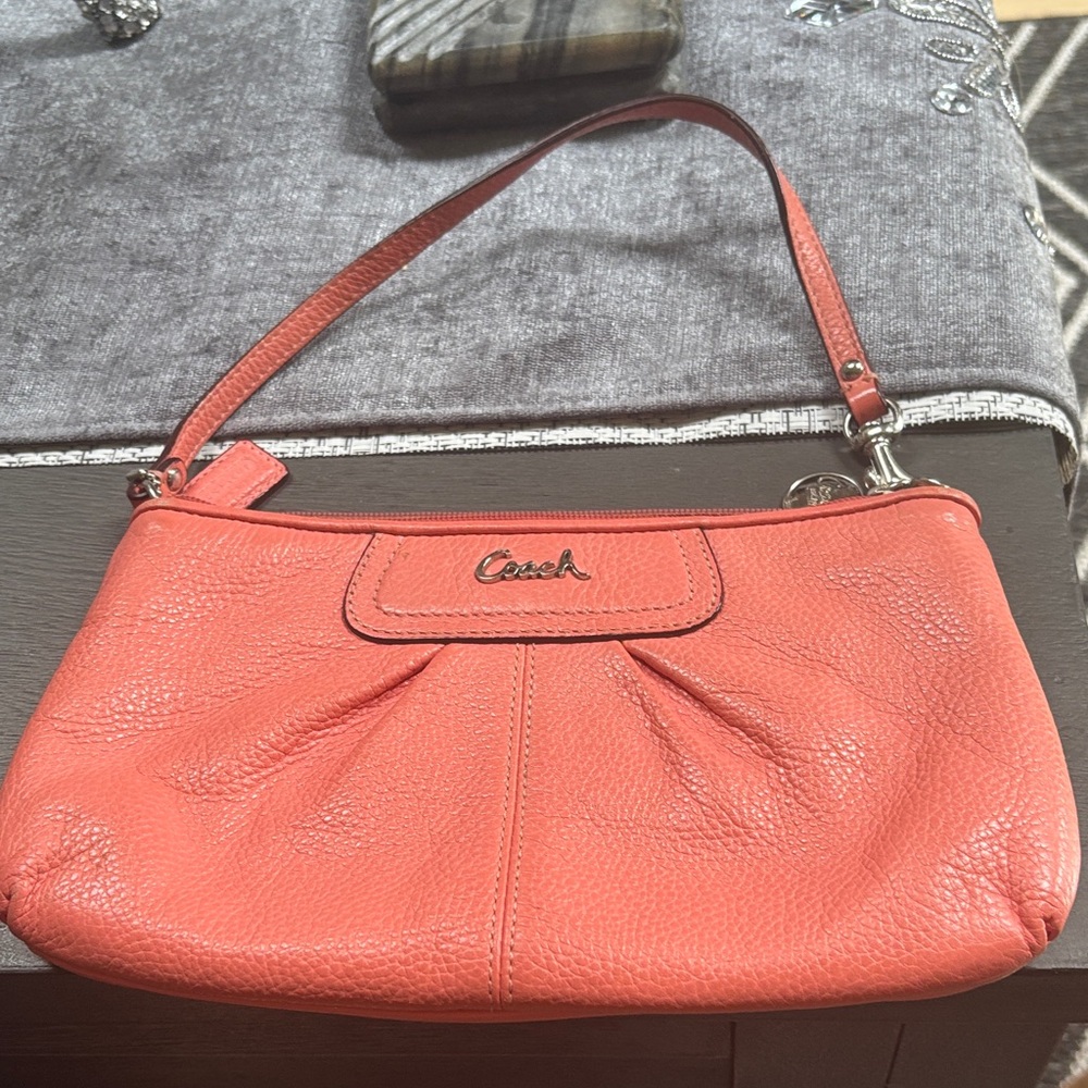 Beautiful zip coach wristlet. Silver hardware places for credit cards and cash